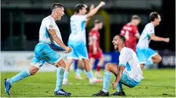 Players of San Marino celebrate their historical first victory in official match