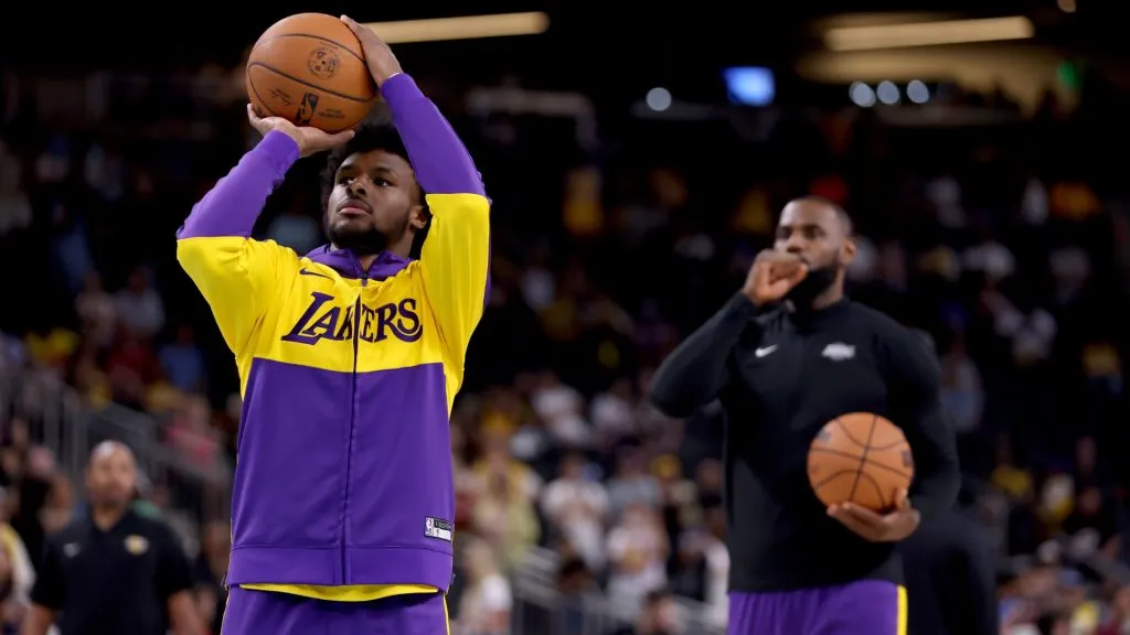 Bronny James #9 and LeBron James #23 of the Los Angeles Lakers warm up prior to the game against the Phoenix Suns at Acrisure Arena on October 06, 2024 in Palm Springs, California. 