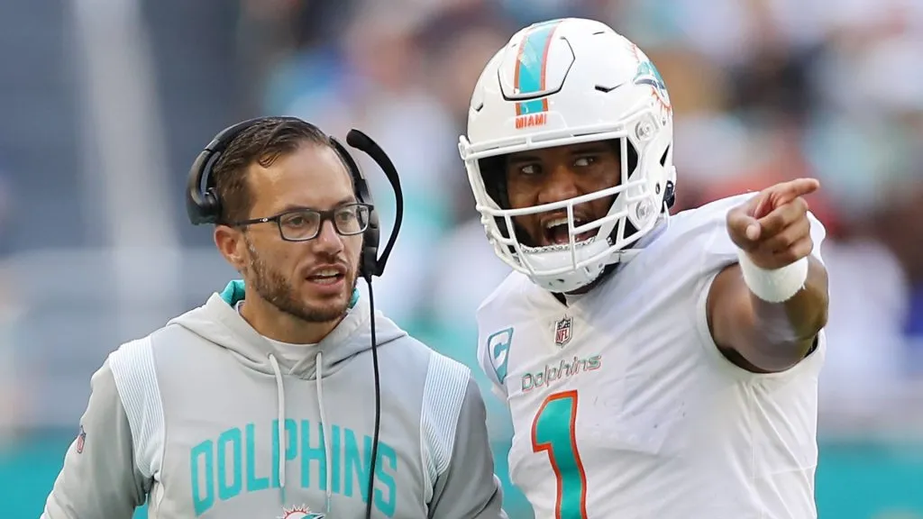 Head coach Mike McDaniel speaks with quarterback Tua Tagovailoa #1 of the Miami Dolphins in the fourth quarter of the game against the Buffalo Bills at Hard Rock Stadium on September 25, 2022 in Miami Gardens, Florida.