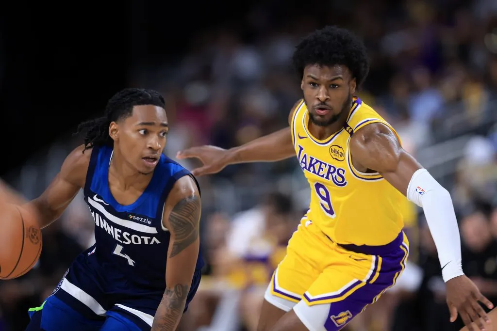 Bronny James #9 of the Los Angeles Lakers defends against Nickeil Alexander-Walker #9 of the Minnesota Timberwolves. Sean M. Haffey/Getty Images