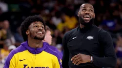Bronny James #9 and LeBron James #23 of the Los Angeles Lakers warm up prior to the game against the Phoenix Suns at Acrisure Arena on October 06, 2024 in Palm Springs, California.