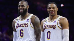 LeBron James #6 and Russell Westbrook #0 of the Los Angeles Lakers speak during the fourth quarter against the Philadelphia 76ers