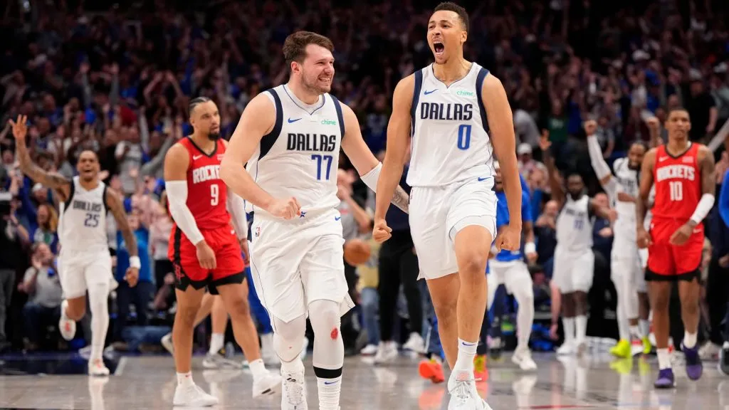 Dante Exum #0 of the Dallas Mavericks celebrates with Luka Doncic #77 after making a buzzer beater 3-pt basket to tie the game in the fourth quarter and force overtime against the Houston Rockets at American Airlines Center . (Photo by Sam Hodde/Getty Images)