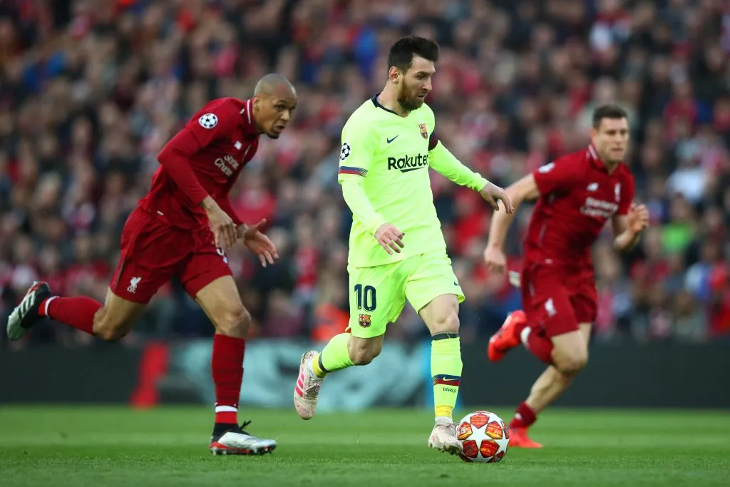 Lionel Messi of Barcelona battles for possession with Fabinho of Liverpool during the UEFA Champions League Semi Final. Clive Brunskill/Getty Images