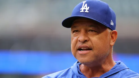Manager Dave Roberts #30 of the Los Angeles Dodgers looks on during warmups prior to facing the Atlanta Braves at Truist Park.