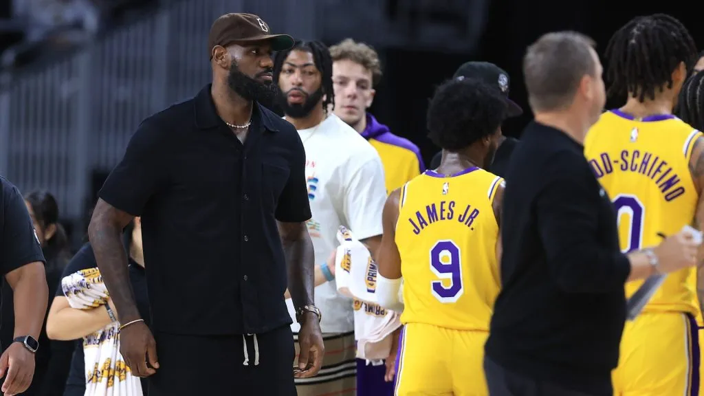 LeBron James #23 looks on as his son Bronny James #9 of the Los Angeles Lakers shoots the ball during the first half of a game against the Minnesota Timberwolves at Acrisure Arena on October 04, 2024 in Palm Springs, California. (Photo by Sean M. Haffey/Getty Images)