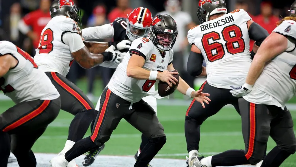 Baker Mayfield #6 of the Tampa Bay Buccaneers scrambles against the Atlanta Falcons during the fourth quarter at Mercedes-Benz Stadium on October 03, 2024 in Atlanta, Georgia.