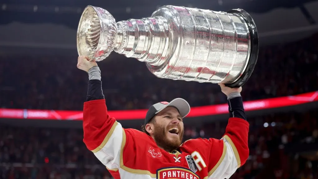Matthew Tkachuk #19 of the Florida Panthers lifts the Stanley Cup after Florida’s 2-1 victory against the Edmonton Oilers in Game Seven of the 2024 Stanley Cup Final at Amerant Bank Arena on June 24, 2024 in Sunrise, Florida.