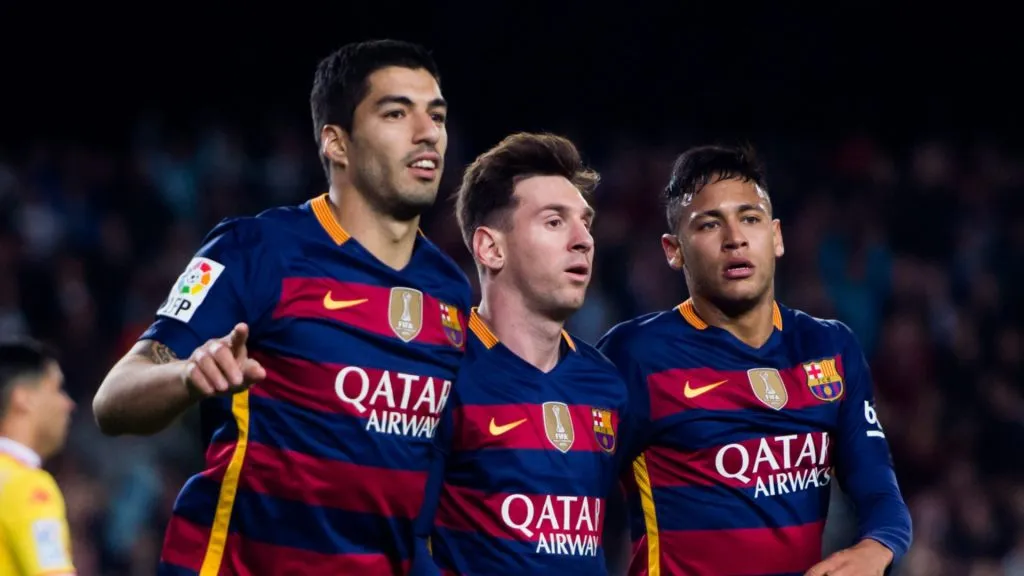 Luis Suarez (L) of FC Barcelona celebrates with his teammates Lionel Messi (C) and Neymar Santos Jr (R) after scoring his team's second goal during the La Liga match between FC Barcelona and Sporting Gijon at Camp Nou on April 23, 2016 in Barcelona, Spain.