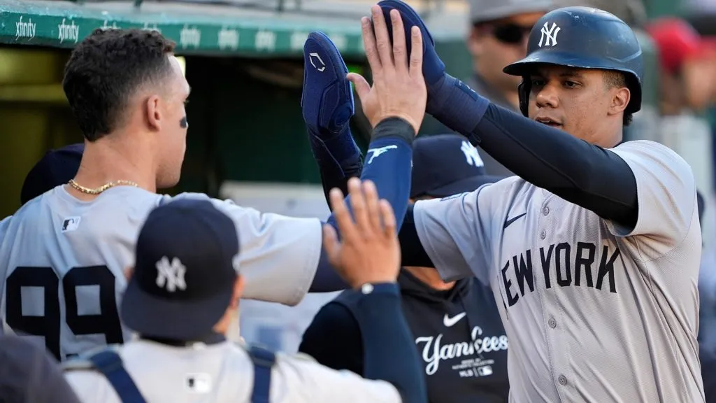 Juan Soto #22 of the New York Yankees is congratulated by Aaron Judge #99 after Soto scored against the Oakland Athletics in the top of the first inning at the Oakland Coliseum. (Photo by Thearon W. Henderson/Getty Images)