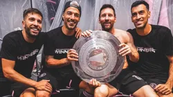 Jordi Alba, Luis Suarez, Lionel Messi, and Sergio Busquets with the Supporters Shield.