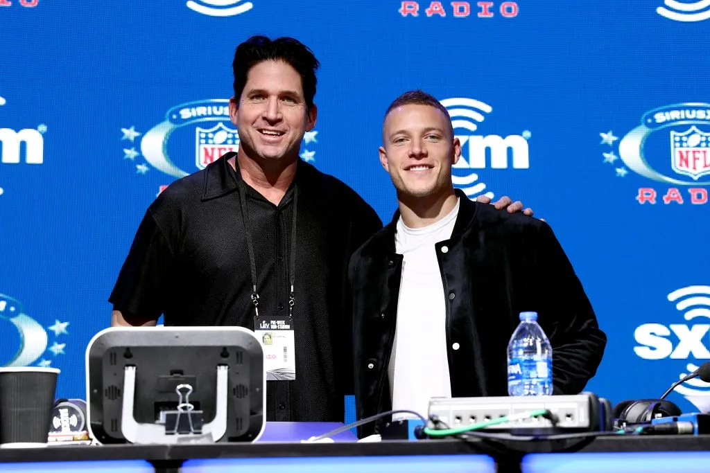 MIAMI, FLORIDA – JANUARY 30: SiriusXM host Ed McCaffrey and NFL running back, Christian McCaffrey of the Carolina Panthers take photos during day 2 of SiriusXM at Super Bowl LIV on January 30, 2020 in Miami, Florida. (Photo by Cindy Ord/Getty Images for SiriusXM )