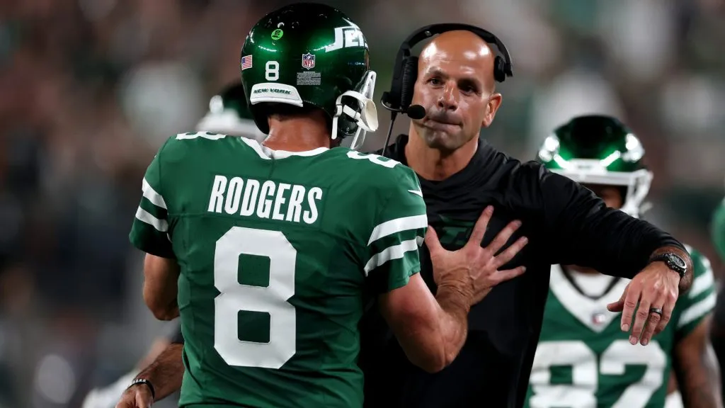 Head coach Robert Saleh of the New York Jets celebrates with Aaron Rodgers after a touchdown against the New England Patriots during the second quarter in the game at MetLife Stadium on September 19, 2024 in East Rutherford, New Jersey. (Photo by Al Bello/Getty Images)