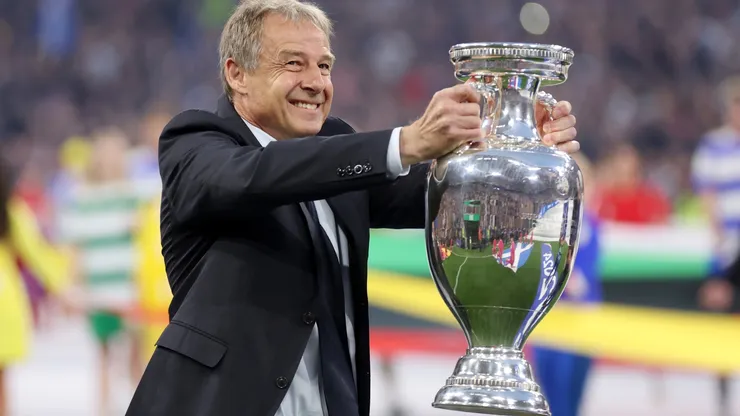 Jurgen Klinsmann, German former professional player and manager, holds the UEFA Euro 2024 Henri Delaunay Trophy prior to kick-off ahead of the UEFA EURO 2024 group stage match between Germany and Scotland at Munich Football Arena on June 14, 2024 in Munich, Germany. (Photo by Lars Baron/Getty Images)