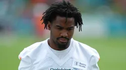 Dolphins wide receiver Jaylen Waddle (17) warms up.