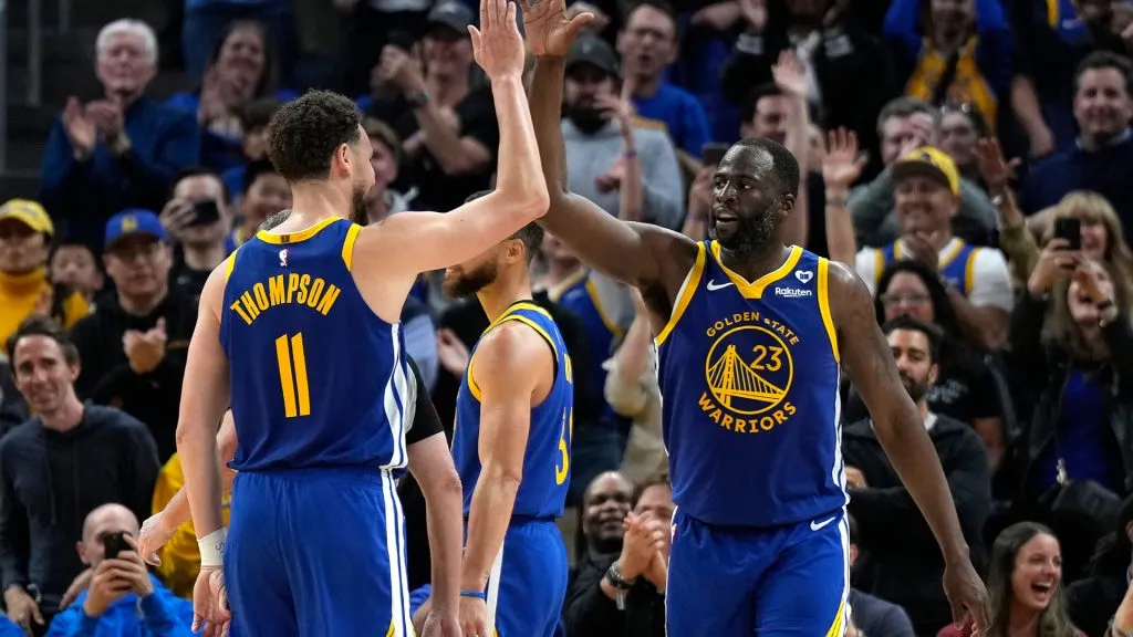 Draymond Green of the Golden State Warriors celebrates with Klay Thompson after scoring against the Dallas Mavericks late in the second half at Chase Center on April 02, 2024 in San Francisco, California. (Photo by Thearon W. Henderson/Getty Images)
