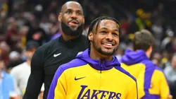 Bronny James #9 and LeBron James #23 of the Los Angeles Lakers warms up prior to the game against the Cleveland Cavaliers at Rocket Mortgage Fieldhouse on October 30, 2024 in Cleveland, Ohio.