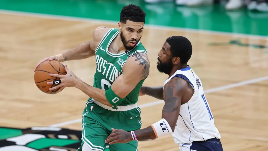 Jayson Tatum #0 of the Boston Celtics drives past Kyrie Irving #11 of the Dallas Mavericks during the first quarter of Game Five of the 2024 NBA Finals at TD Garden. (Adam Glanzman/Getty Images)