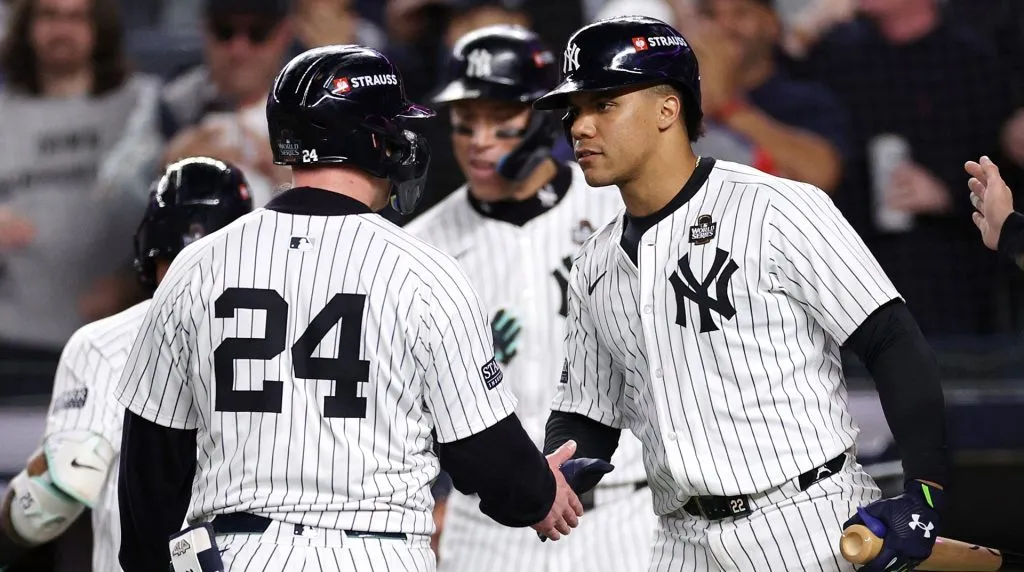 Alex Verdugo #24 of the New York Yankees is congratulated by Juan Soto #22 after scoring during the eighth inning of Game Four of the 2024 World Series against the Los Angeles Dodgers at Yankee Stadium. (Photo by Elsa/Getty Images)