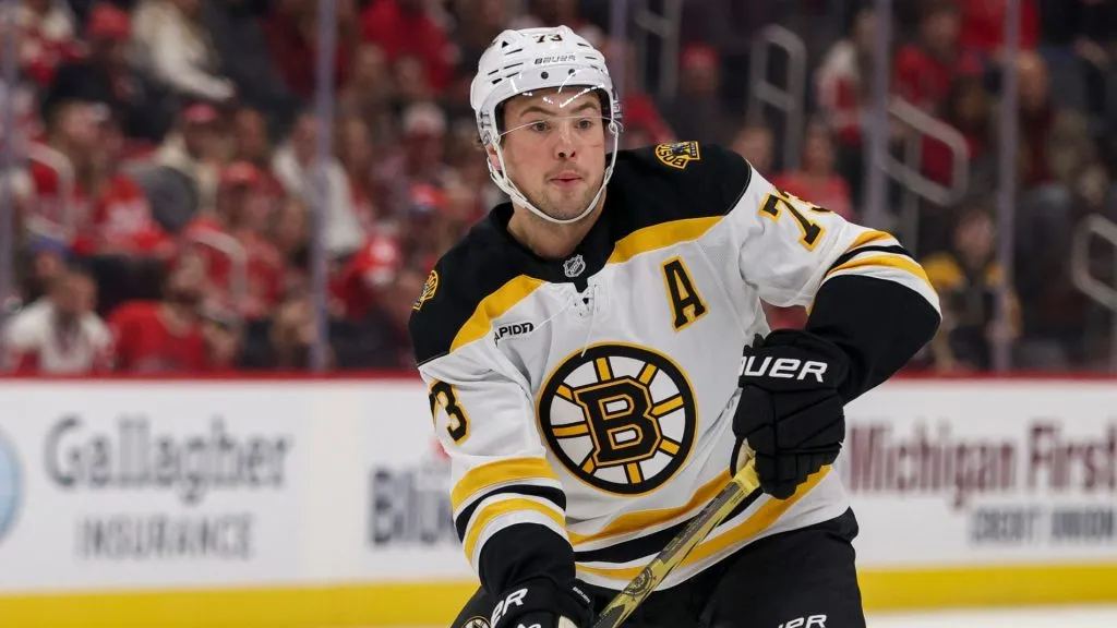 Charlie McAvoy #73 of the Boston Bruins passes the puck away during the first period of a game of a game against the Detroit Red Wings at Little Caesars Arena on November 23, 2024 in Detroit, Michigan.