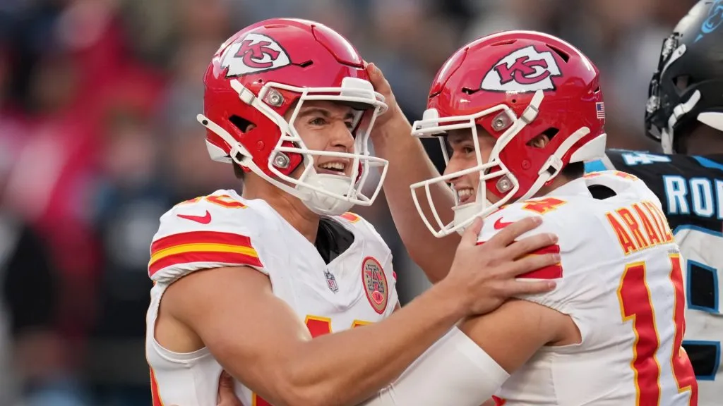 Spencer Shrader #40 celebrates with Matt Araiza #14 of the Kansas City Chiefs after kicking the game-winning field goal to beat the Carolina Panthers 30-27 at Bank of America Stadium on November 24, 2024 in Charlotte, North Carolina.