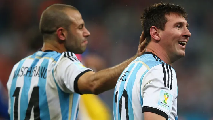 Javier Mascherano and Lionel Messi of Argentina celebrate victory over the Netherlands in a penalty shootout during the 2014 FIFA World Cup Brazil Semi Final match between the Netherlands and Argentina at Arena de Sao Paulo on July 9, 2014 in Sao Paulo, Brazil.