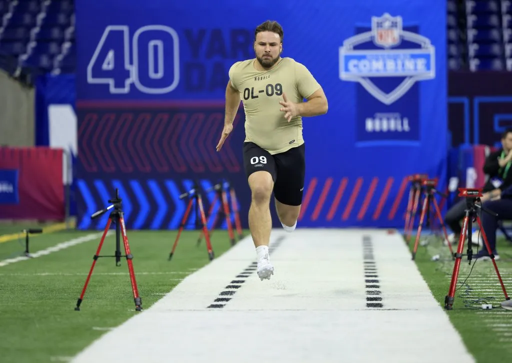 INDIANAPOLIS, INDIANA – MARCH 03: Tanor Bortolini #OL09 of Wisconsin participates in the 40-yard dash during the NFL Combine at Lucas Oil Stadium on March 03, 2024 in Indianapolis, Indiana. (Photo by Justin Casterline/Getty Images)