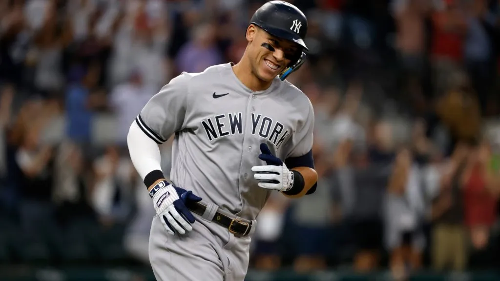 Aaron Judge smiles as he rounds the bases after hitting his 62nd home run of the season against the Texas Rangers during the first inning in game two of a double header at Globe Life Field on October 4, 2022. (Source: Ron Jenkins/Getty Images)