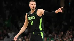 Kristaps Porzingis #8 of the Boston Celtics reacts after making a three-point basket against the LA Clippers during the first quarter at the TD Garden on November 25, 2024 in Boston, Massachusetts.