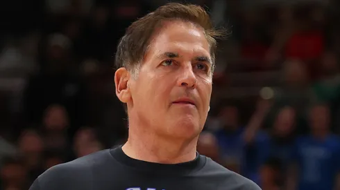 Mark Cuban of the Dallas Mavericks high fives Maxi Kleber #42 after they defeated the Chicago Bulls at the United Center on March 11, 2024 in Chicago, Illinois.