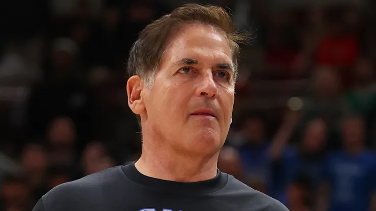 Mark Cuban of the Dallas Mavericks high fives Maxi Kleber #42 after they defeated the Chicago Bulls at the United Center on March 11, 2024 in Chicago, Illinois.