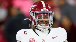 Quarterback Jalen Milroe #4 of the Alabama Crimson Tide smiles before a game against the Oklahoma Sooners at Gaylord Family Oklahoma Memorial Stadium on November 23, 2024 in Norman, Oklahoma.