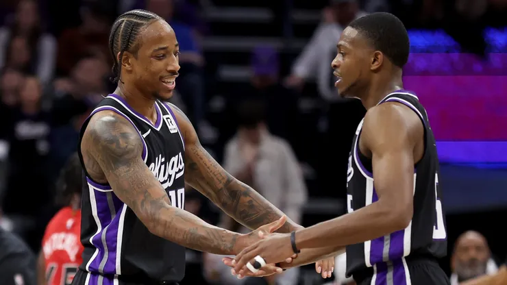 DeMar DeRozan #10 of the Sacramento Kings and De'Aaron Fox #5 react after DeRozan made a basket against the Toronto Raptors in the second half at Golden 1 Center on November 06, 2024 in Sacramento, California.