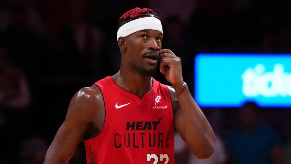 Jimmy Butler #22 of the Miami Heat react against the Dallas Mavericks during overtime at Kaseya Center on November 24, 2024 in Miami, Florida.