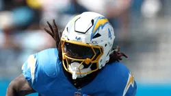 Running back Gus Edwards #4 of the Los Angeles Chargers carries the ball during the first half of the game against the Carolina Panthers at Bank of America Stadium on September 15, 2024 in Charlotte, North Carolina.