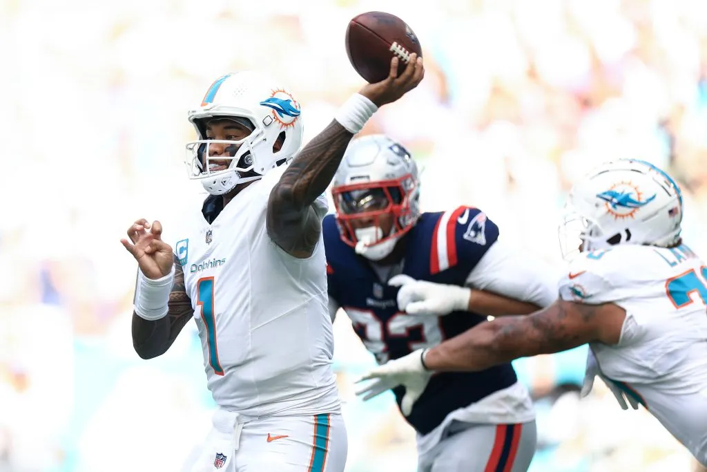 Tua Tagovailoa #1 of the Miami Dolphins throws a pass against the New England Patriots