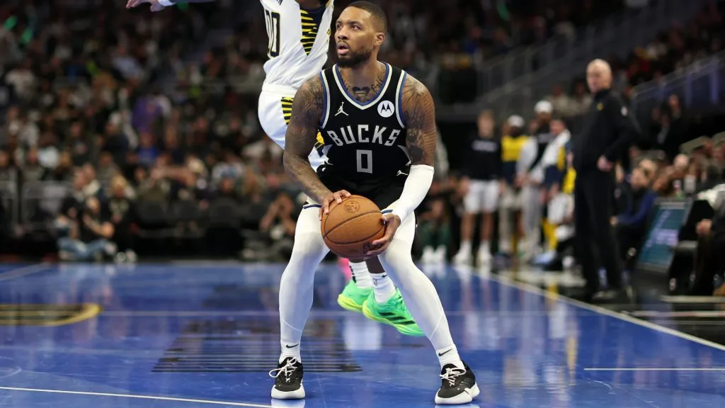 Damian Lillard #0 of the Milwaukee Bucks is defended by Bennedict Mathurin #00 of the Indiana Pacers during the second half of a game in the NBA Emirates Cup at Fiserv Forum. (Stacy Revere/Getty Images)