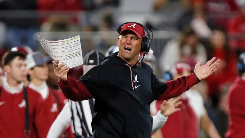 Head coach Kalen DeBoer of the Alabama Crimson Tide reacts with a look in the direction of side judge Victor Sanchez after a play against the Oklahoma Sooners in the fourth quarter at Gaylord Family Oklahoma Memorial Stadium on November 23, 2024 in Norman, Oklahoma. Oklahoma won 24-3.