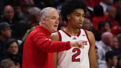 Head coach Steve Pikiell of the Rutgers Scarlet Knights speaks with Dylan Harper #2 of the Rutgers Scarlet Knights during the second half of their game against the St. John's Red Storm at Jersey Mike's Arena on October 17, 2024 in Piscataway, New Jersey.