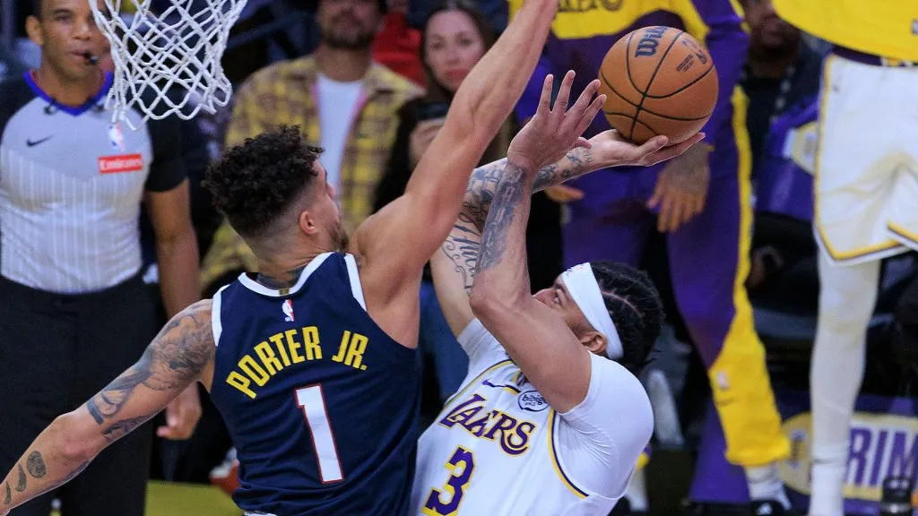 Anthony Davis 3 of the Los Angeles Lakers is defended by Michael Porter Jr. 1 of the Denver Nuggets as he drives to the basekt during a regular season NBA game. (IMAGO / ZUMA Press Wire)