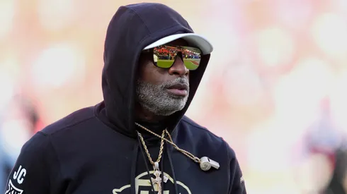 Head coach Deion Sanders of the Colorado Buffaloes watches his team warm up prior to a game against the Kansas Jayhawks at Arrowhead Stadium on November 23, 2024 in Kansas City, Missouri.