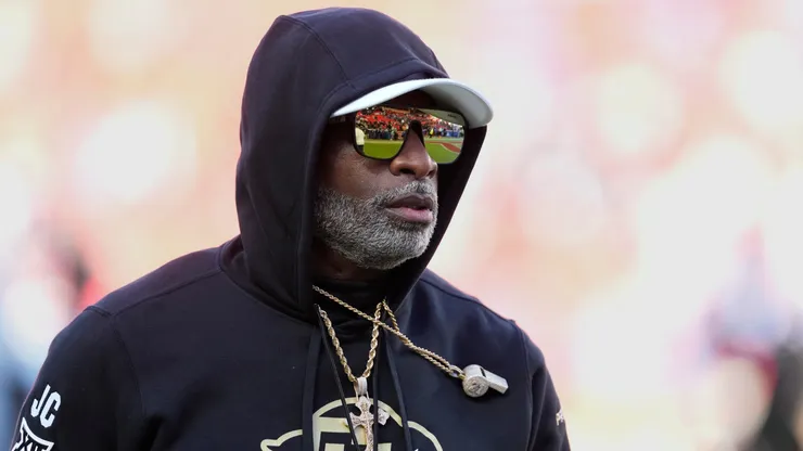 Head coach Deion Sanders of the Colorado Buffaloes watches his team warm up prior to a game against the Kansas Jayhawks at Arrowhead Stadium on November 23, 2024 in Kansas City, Missouri.