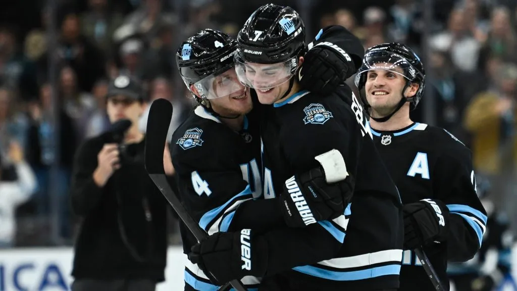 Juuso Valimaki #4 hugs Michael Kesselring #7 of the Utah Hockey Club after winning in overtime in a game against the Boston Bruins at Delta Center on October 19, 2024. (Source: Alex Goodlett/Getty Images)