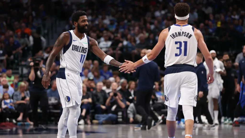 Kyrie Irving #11 and Klay Thompson #31 of the Dallas Mavericks celebrate after a score during the second half against the Orlando Magic at American Airlines Center on November 03, 2024 in Dallas, Texas.