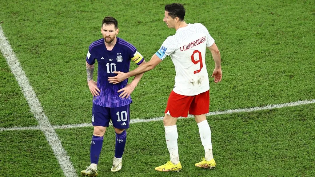 Lionel Messi of Argentina is embraced by Robert Lewandowski of Poland during the FIFA World Cup Qatar 2022 Group C match between Poland and Argentina at Stadium 974 on November 30, 2022 in Doha, Qatar.