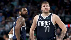 Kyrie Irving #11 and Luka Doncic #77 of the Dallas Mavericks react during the fourth quarter in Game Four of the Western Conference Second Round Playoffs at American Airlines Center