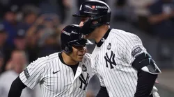 Aaron Judge #99 of the New York Yankees is congratulated by Juan Soto #22 after hitting a two-run home run during the first inning of Game Five of the 2024 World Series against the Los Angeles Dodgers at Yankee Stadium.