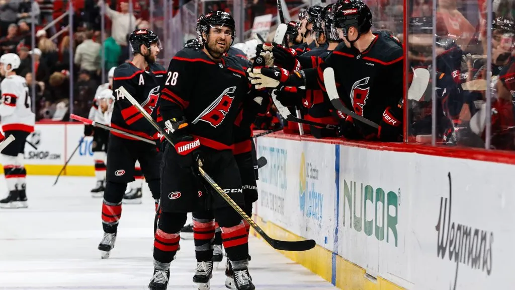 William Carrier #28 of the Carolina Hurricanes celebrates a goal with the bench during the third period of the game against the Ottawa Senators at Lenovo Center on November 16, 2024. (Source: Jaylynn Nash/Getty Images)