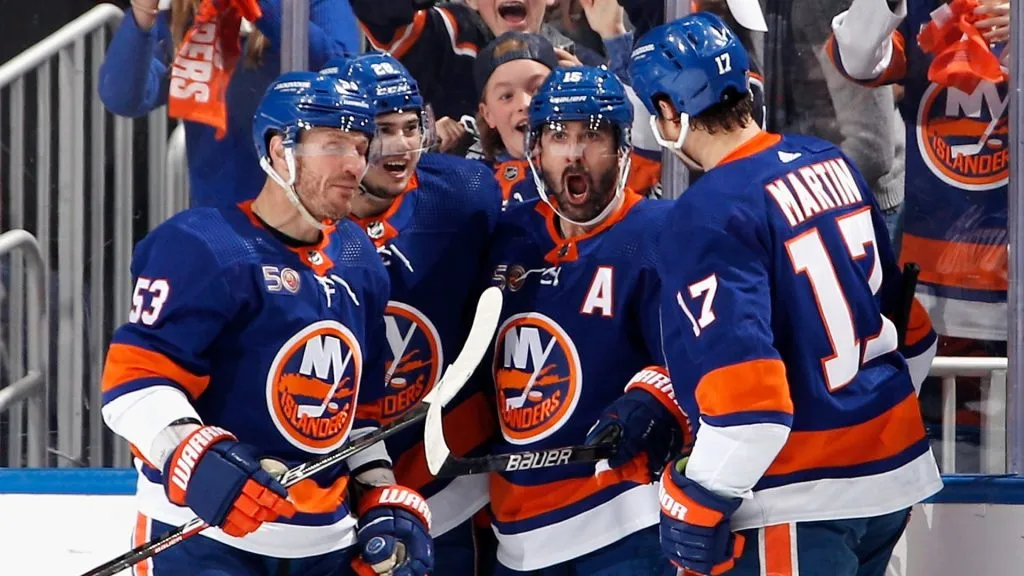 Cal Clutterbuck #15 of the New York Islanders (2n from right) celebrates his first period goal against the Carolina Hurricanes in Game Six of the First Round of the 2023 Stanley Cup Playoffs. (Source: Bruce Bennett/Getty Images)