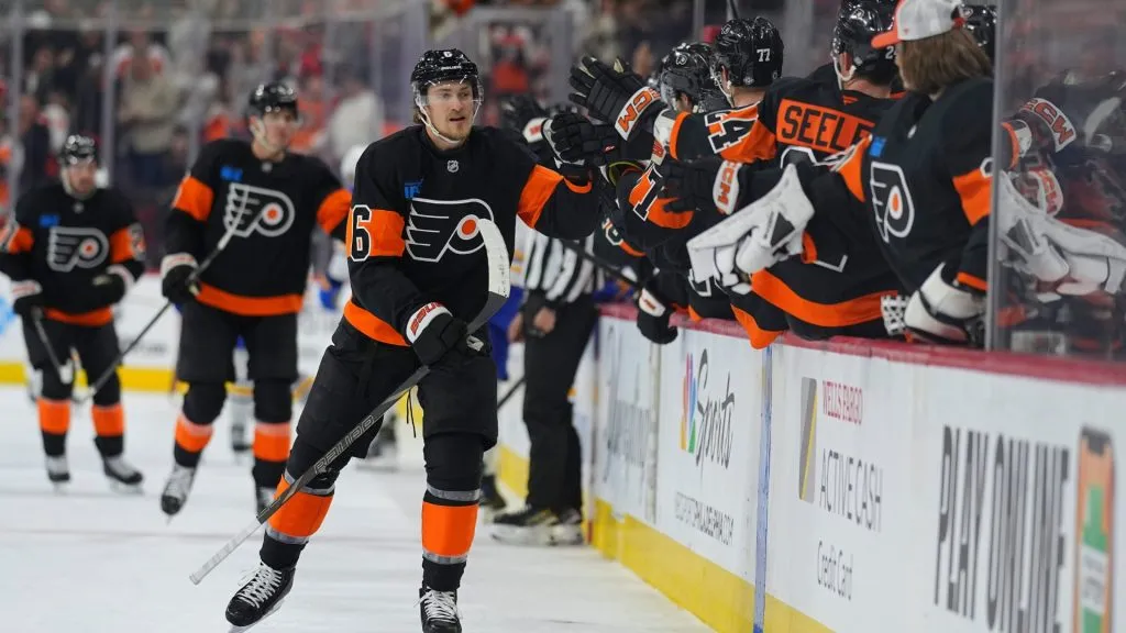 Travis Sanheim of the Philadelphia Flyers skates by the team bench and celebrates his goal with teammates in the first period of their game against the Buffalo Sabres at the Wells Fargo Center in 2024. (Source: Mitchell Leff/Getty Images)